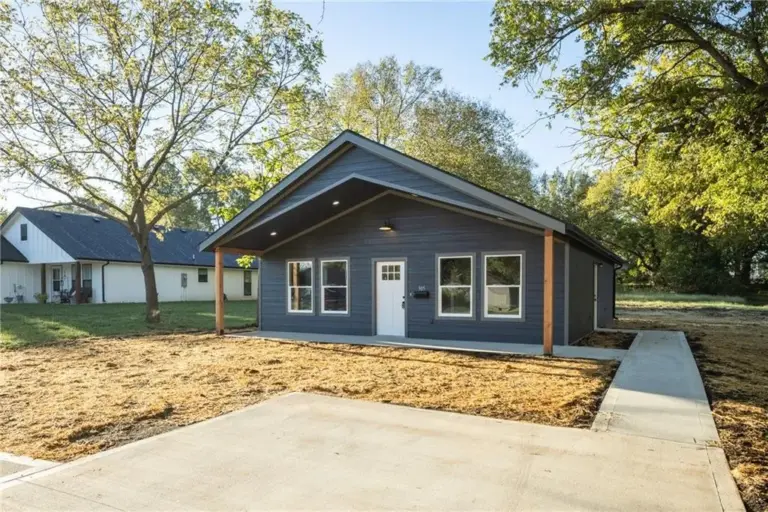Front exterior from driveway at 305 E Pacific St, Holden, Missouri - DRAT House 2