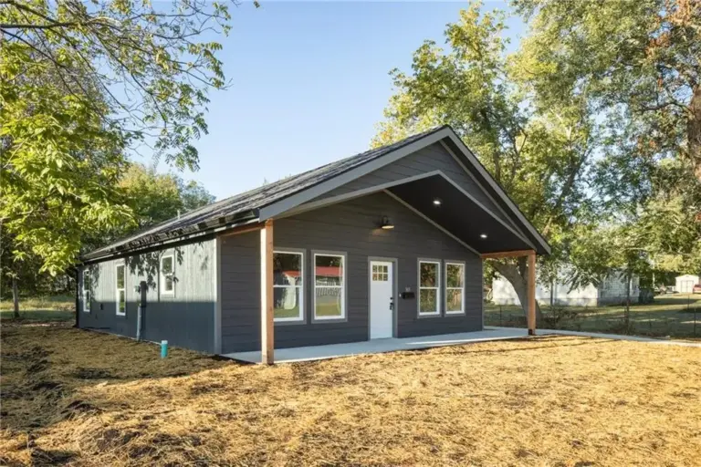 Front and side exterior at 305 E Pacific St, Holden, Missouri - DRAT House 2