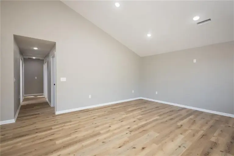 Living area with ceiling fan at 305 E Pacific St, Holden, Missouri - DRAT House 2