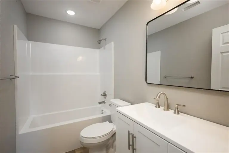 Bathroom with tub and vanity at 305 E Pacific St, Holden, Missouri - DRAT House 2