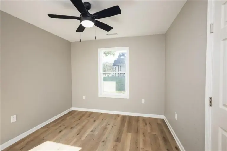 Bedroom with ceiling fan at 305 E Pacific St, Holden, Missouri - DRAT House 2