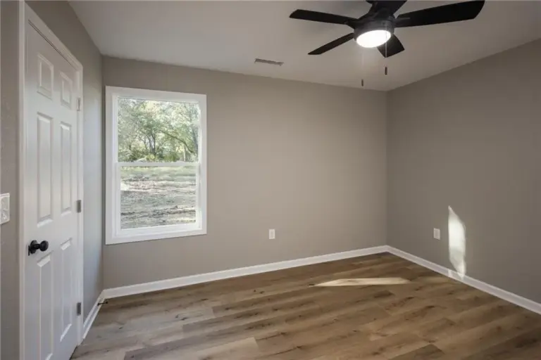 Bedroom with two windows at 305 E Pacific St, Holden, Missouri - DRAT House 2
