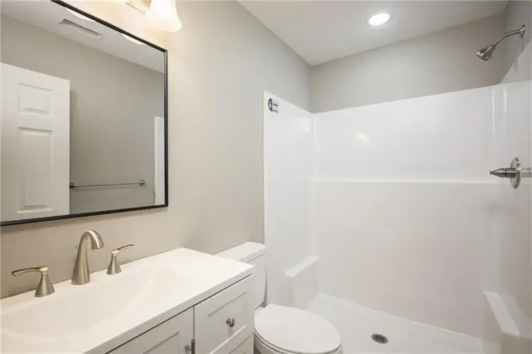 Bathroom vanity and tub at 305 E Pacific St, Holden, Missouri - DRAT House 2
