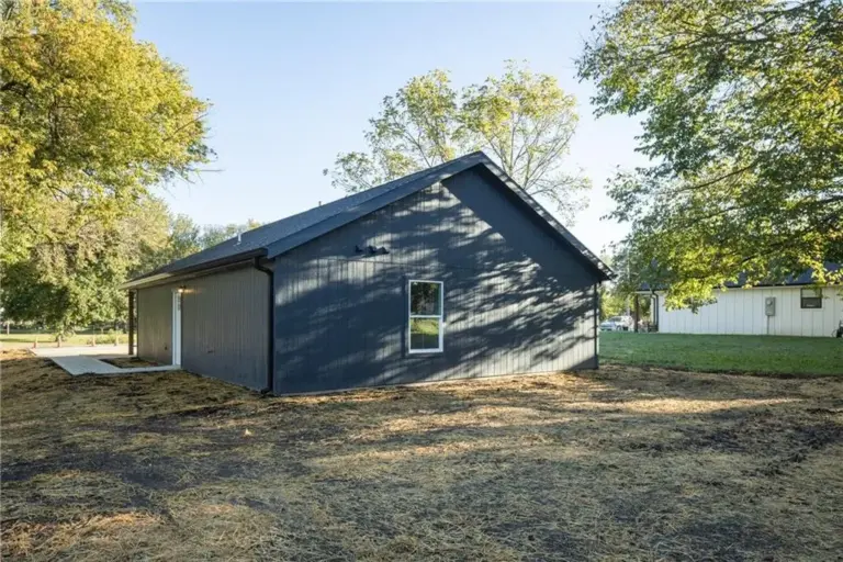 Rear exterior and yard at 305 E Pacific St, Holden, Missouri - DRAT House 2