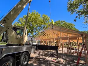 Crane lifting roof trusses at DRAT House #2 in Holden, Missouri