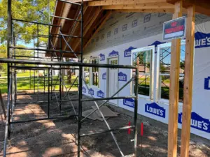 Front porch siding and window work at DRAT House #2 in Holden, Missouri