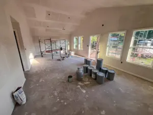 Drywall finishing in the living area at DRAT House #2 in Holden, Missouri