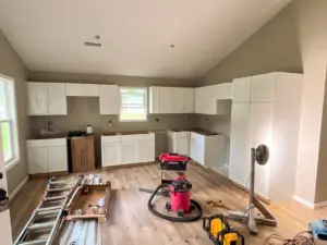Kitchen cabinets and flooring installation at DRAT House #2 in Holden, Missouri